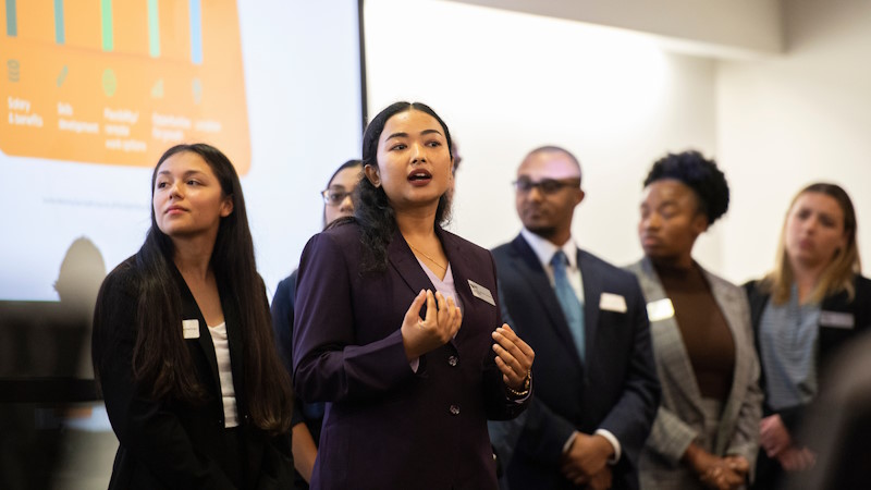 Students presenting in a classroom.