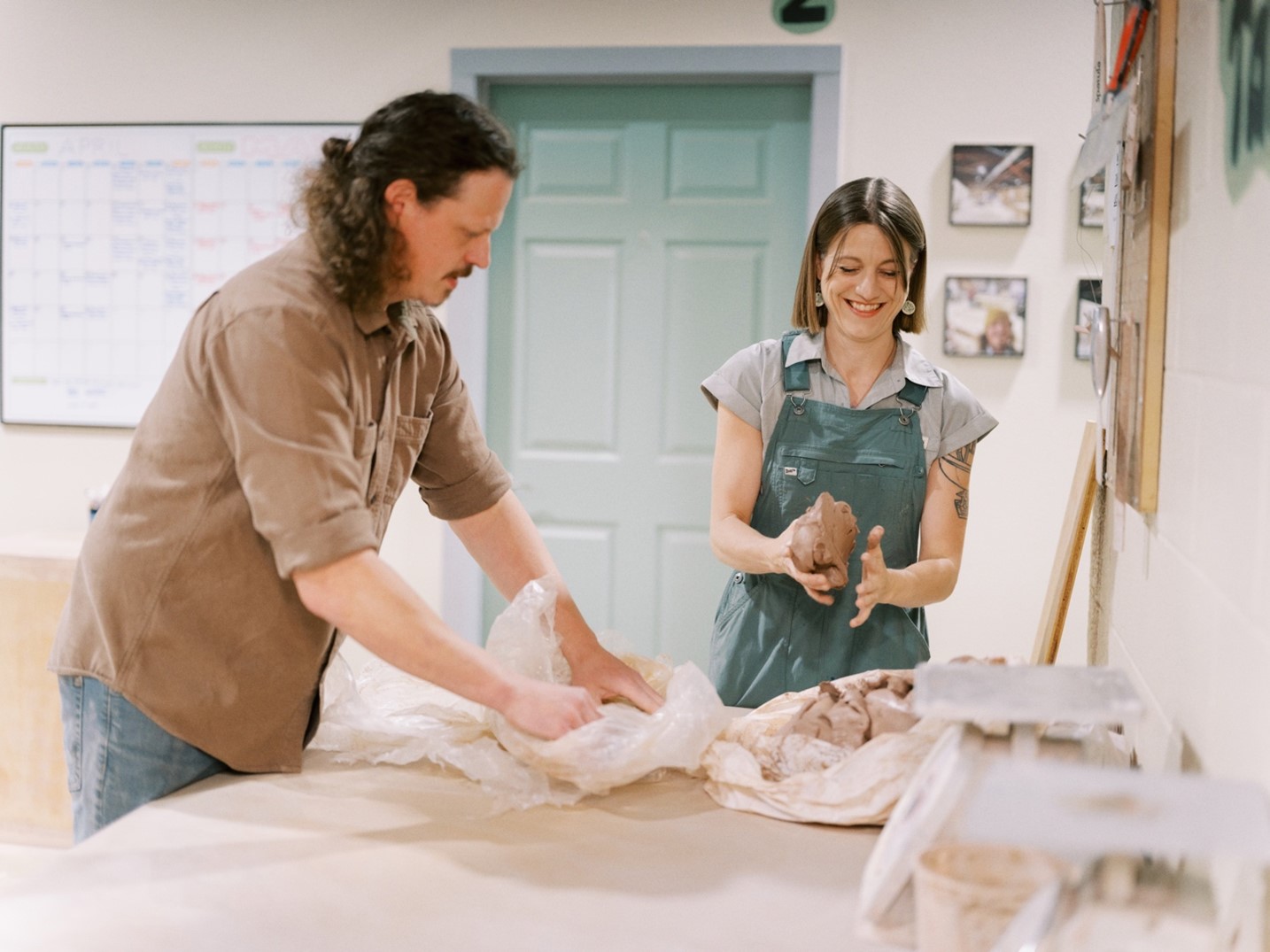 Erin McSweeny and her partner, John Campbell, preparing class clay at their community studio in Garland, Texas.