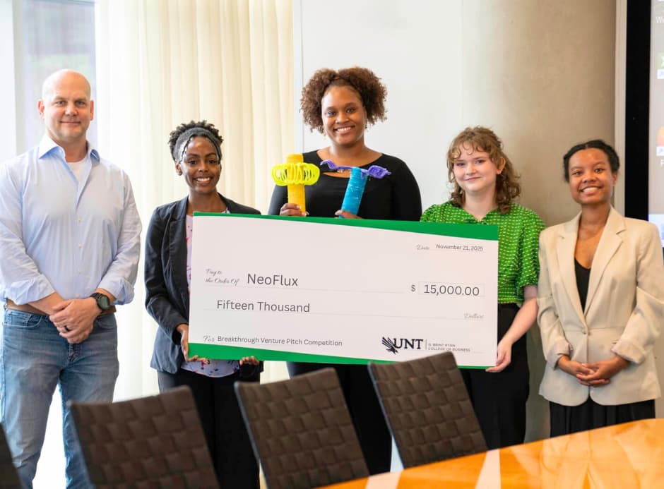 Breakthrough Venture Competition winning team, NeoFlux, poses with Jon McCarry, Executive Director of the Murphy Center.